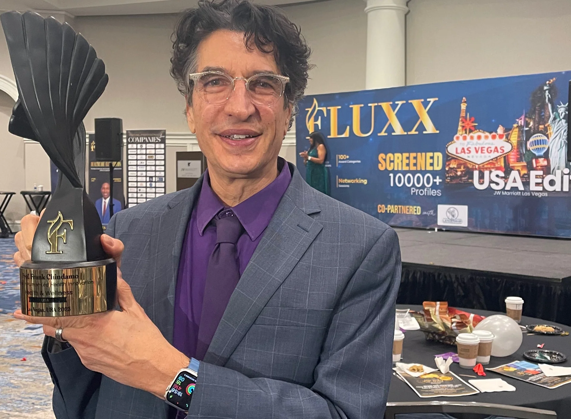 Prof. Frank Chindamo with award at FLUXX conference
